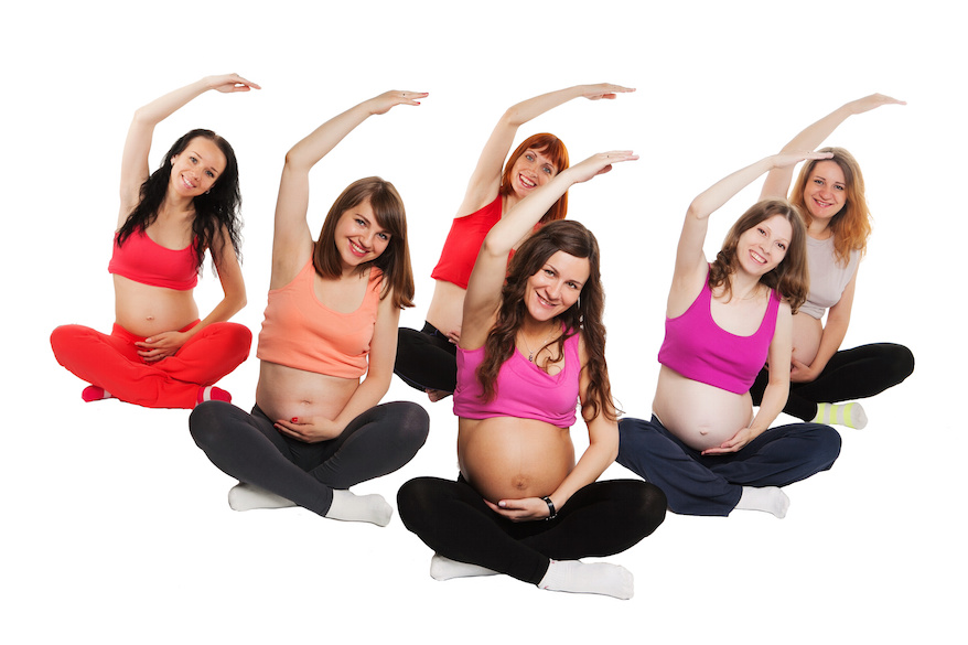 group of six pregnant women doing yoga. isolated on white